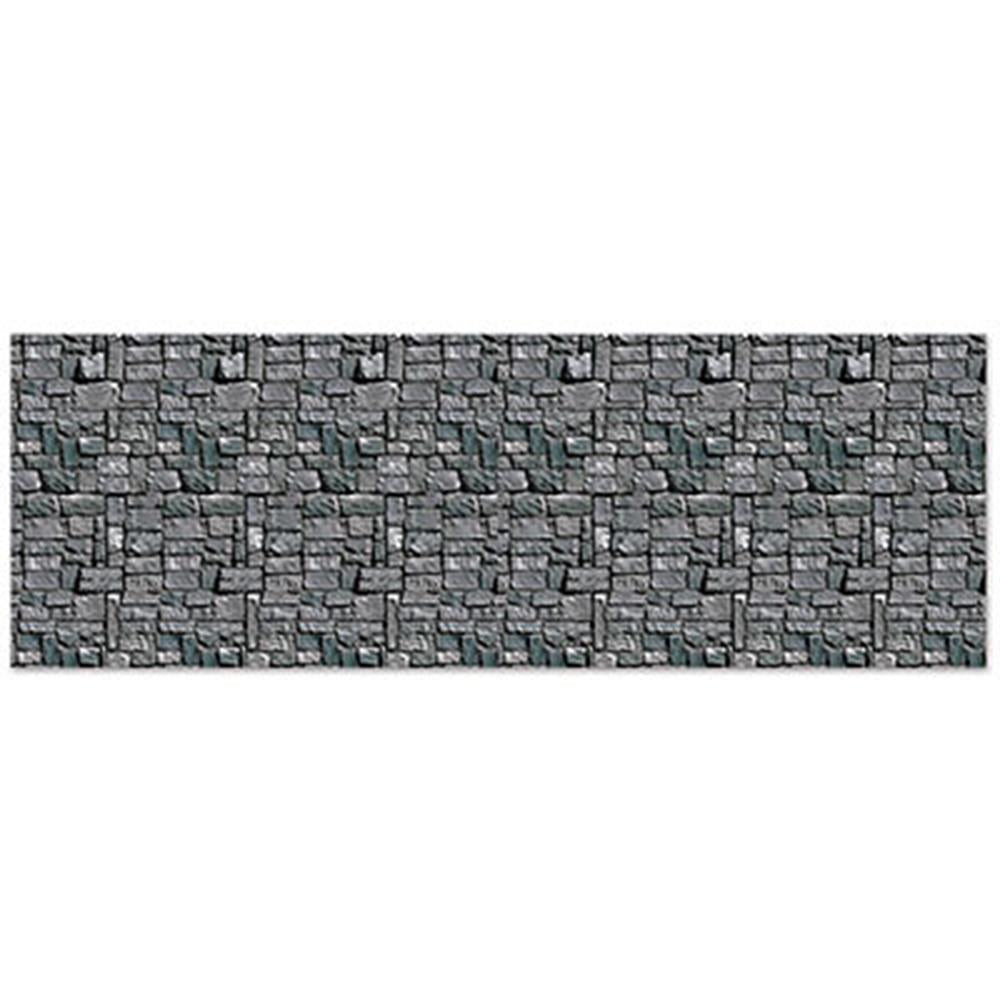 Gray stone wall backdrop with irregular rectangular textured blocks and mortar detailing.