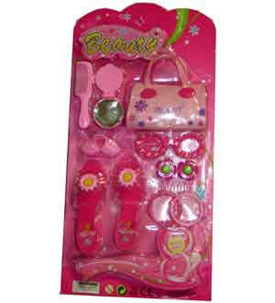 Pink beauty set with small purse, hairbrush, sunglasses, toy jewelry, and makeup accessories in blister pack.