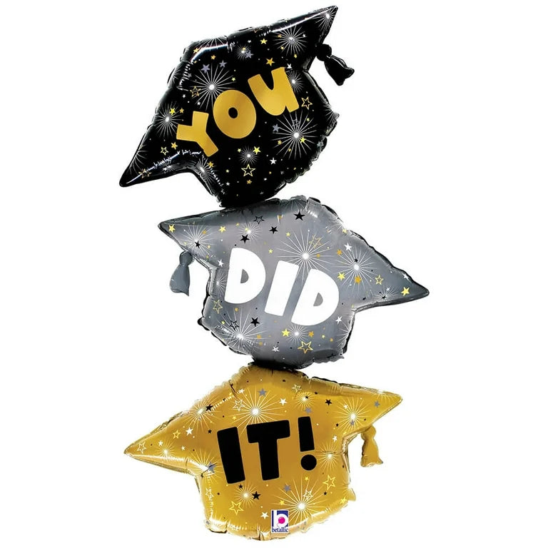 Set of three 38-inch foil balloons shaped as graduation caps in black, silver, and gold with "YOU," "DID," and "IT!" text.