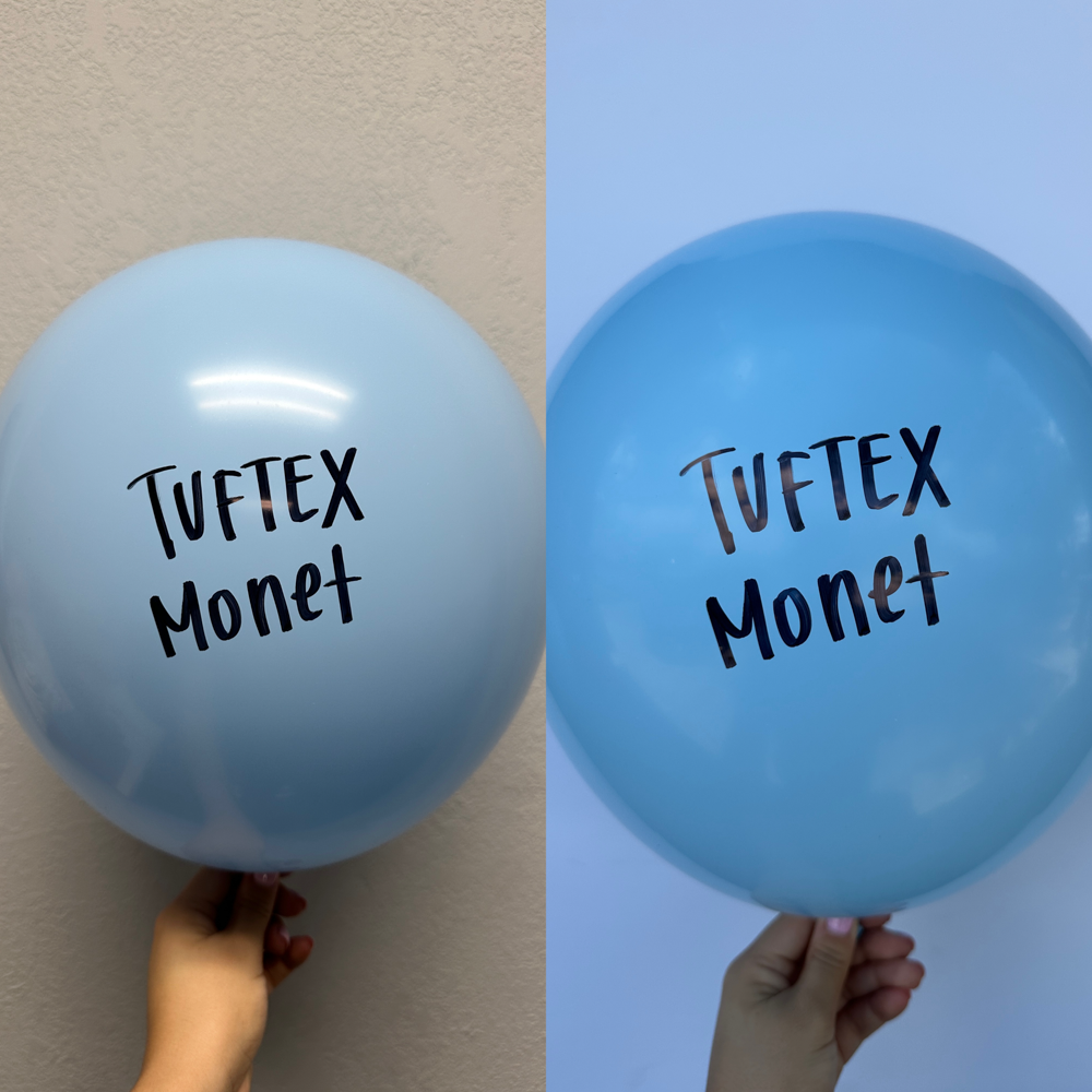 Two light blue 11-inch latex balloons with black "TUFTEZ Monet" text held against neutral and blue backgrounds.