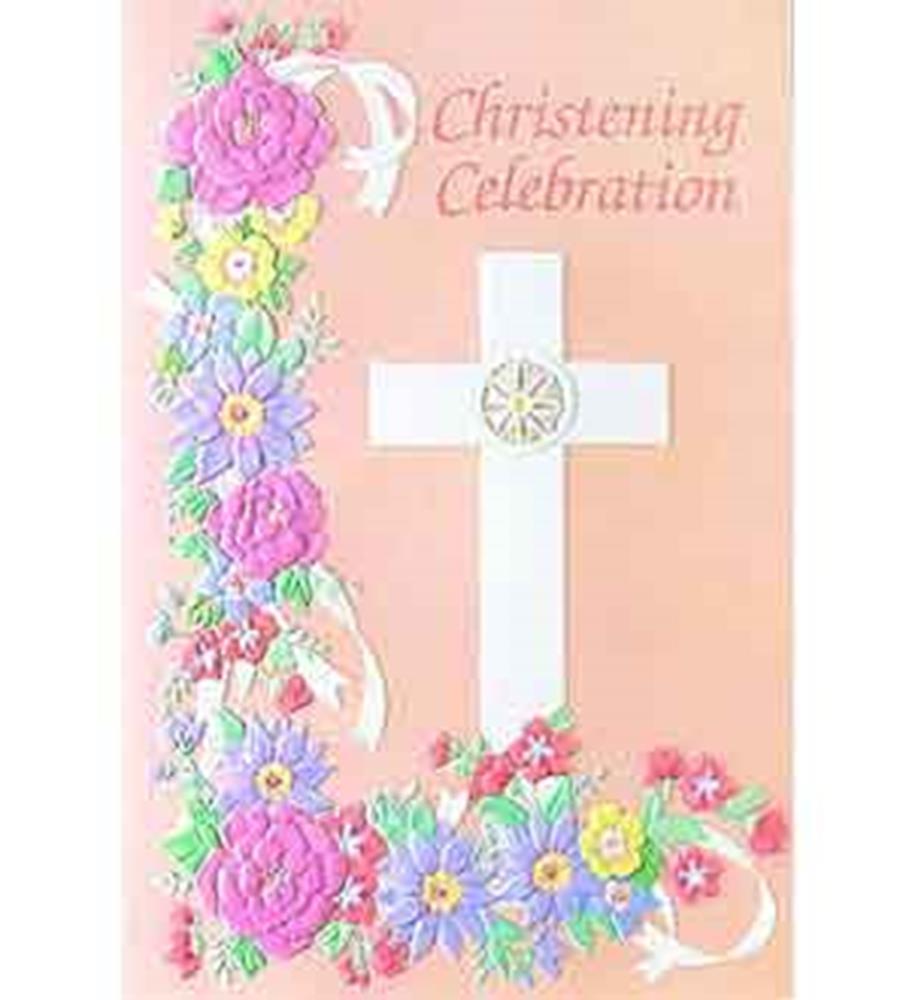 Soft pink card with white cross embellished by pastel purple, yellow, and pink embroidered flowers and green leaves, reading