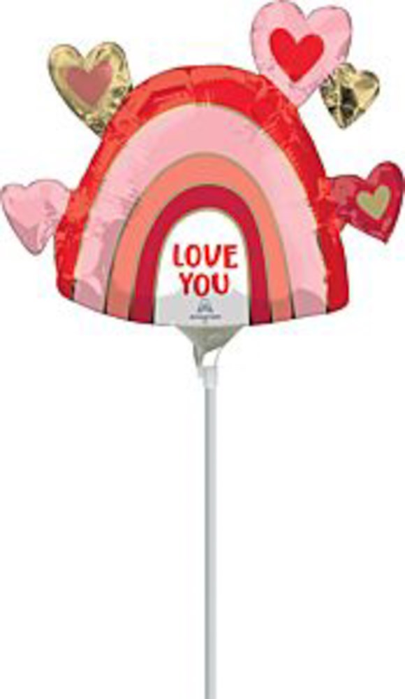 Rainbow-shaped foil balloon with layered pink and red arches, decorated with heart shapes and "Love You" text in the center.