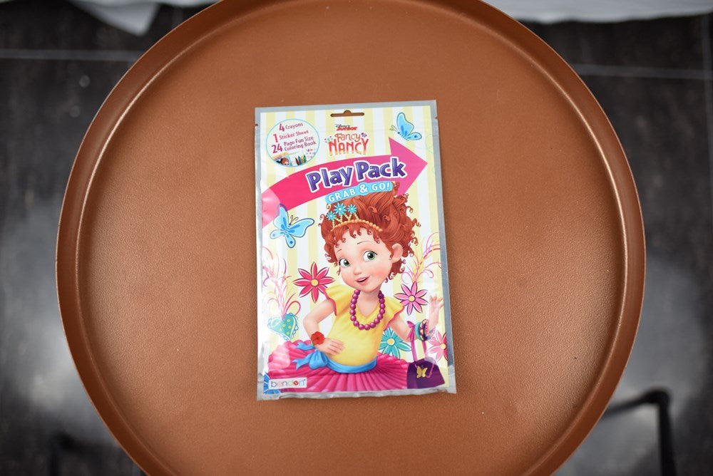 Rectangular colorful play pack featuring a cartoon girl with red hair and floral decorations on a white background.