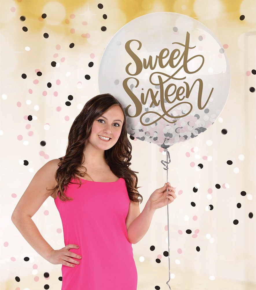 Clear latex balloon with gold "Sweet Sixteen" script and pink, black, and gold confetti inside.