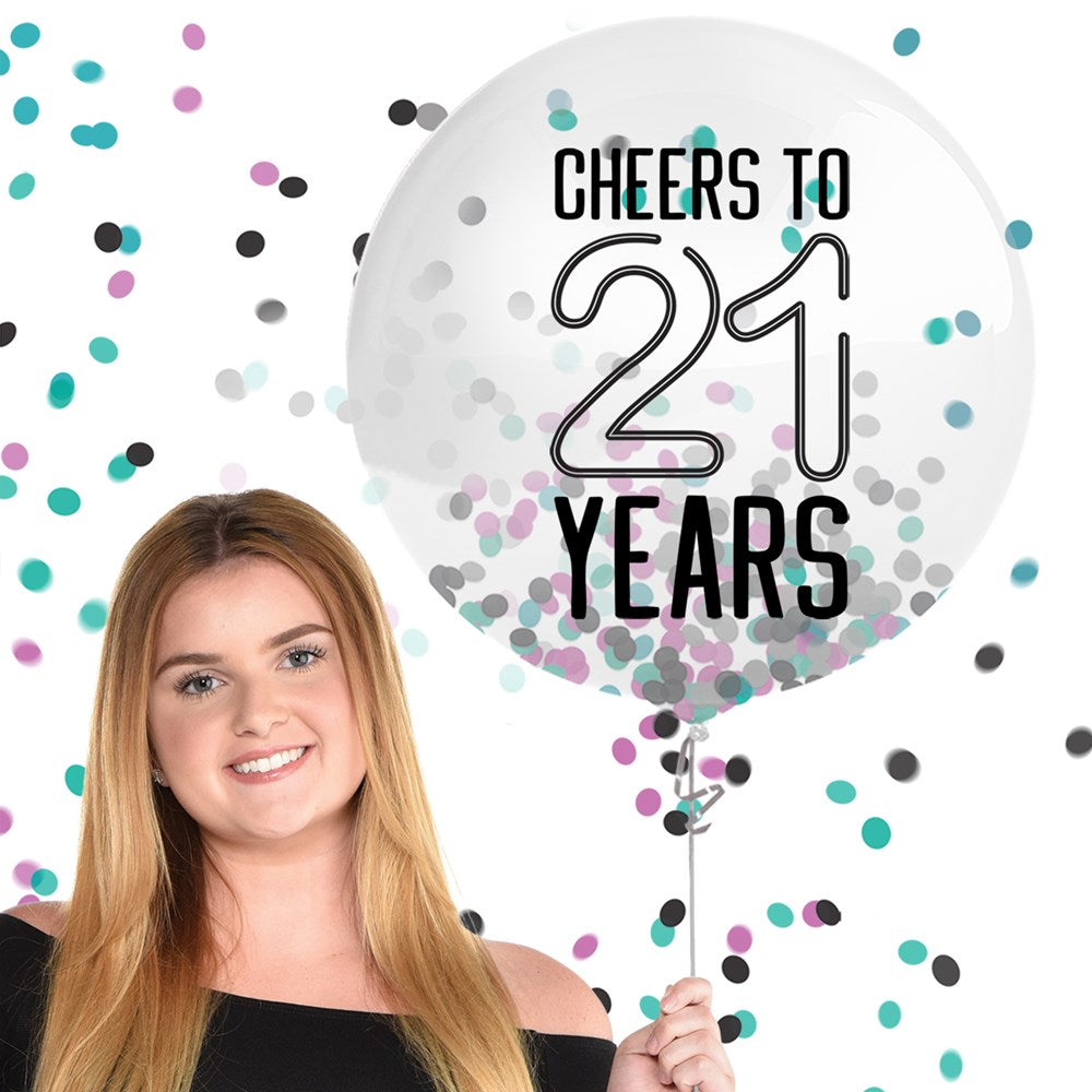 Transparent 24-inch latex balloon filled with black, silver, and purple confetti and printed text "Cheers to 21 years".