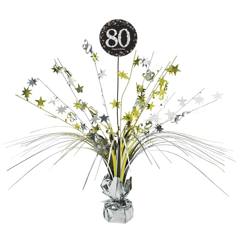 Black and gold 80th birthday centerpiece spray with star bursts and metallic foil accents.