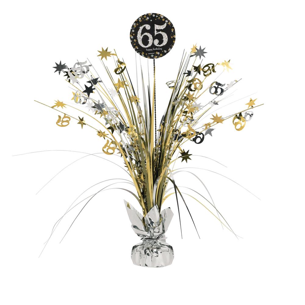 Black and gold 65-themed birthday centerpiece spray with star and number accents in metallic foil.