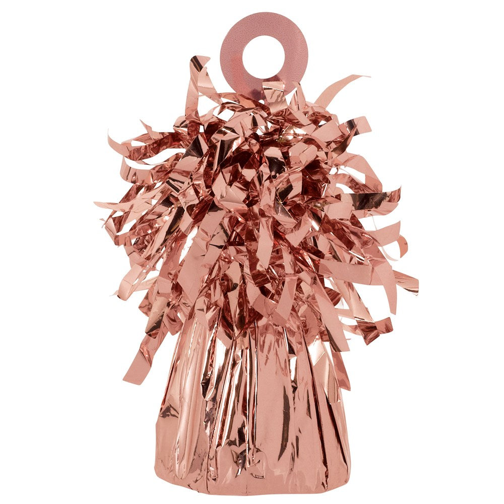 Rose gold foil balloon weight with shiny crinkled tassels and circular handle on top.