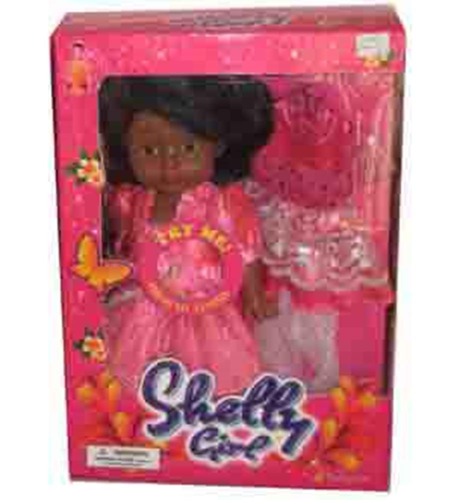 Shelly doll with dark skin wearing pink dress inside pink floral party toy packaging.