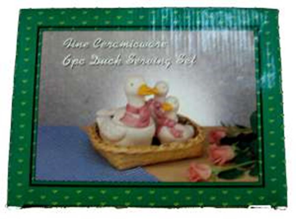 Ceramic duck family figurine with two adult ducks and ducklings on a textured basket base.