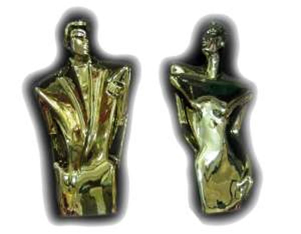 Sleek gold ceramic figurines of a man and woman with abstract, stylized torsos and smooth, reflective surfaces.