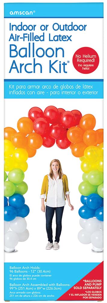Brightly colored latex balloons in red, orange, yellow, green, and blue forming an arch with a woman standing beneath it.