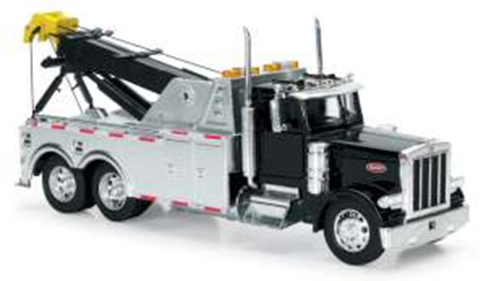 32 scale Peterbilt tow truck toy with yellow tow arm and detailed cab features.