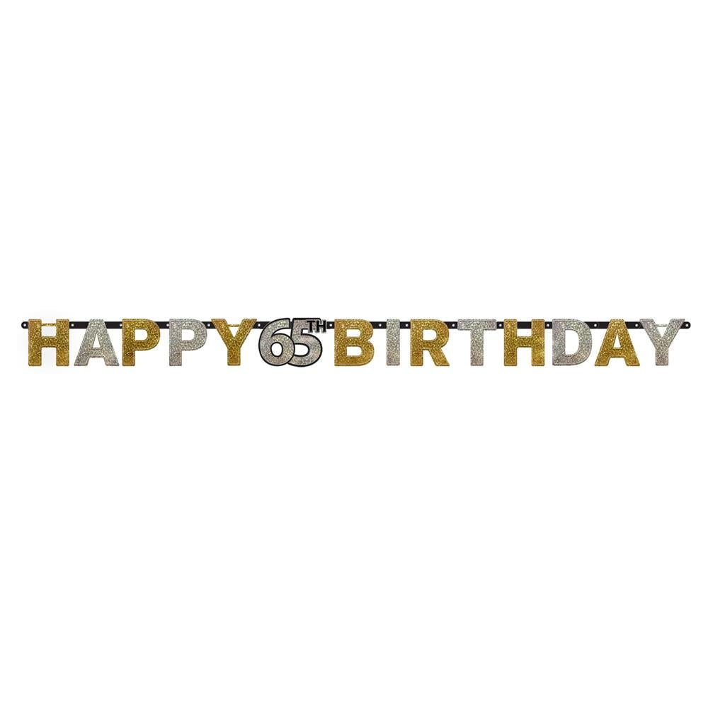 Prismatic gold "Happy 65 Birthday" letter banner with sparkling finish on white background.
