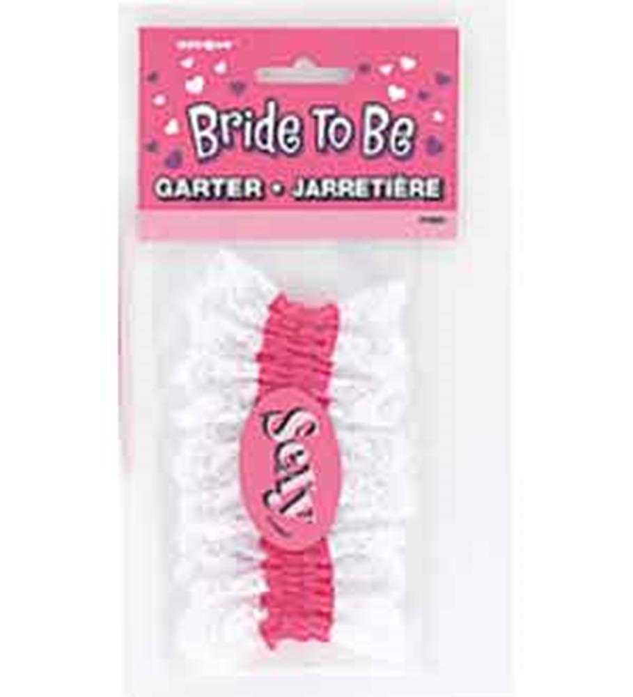 White lace garter with pink elastic band and pink oval centerpiece reading "SAY".