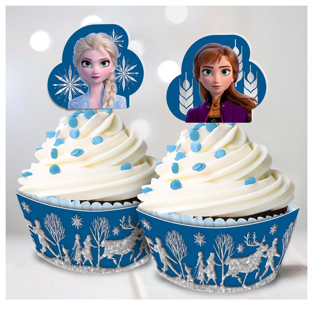 Blue cupcake liners with white silhouettes of Frozen characters and white swirl frosting topped with blue glitter dots and.