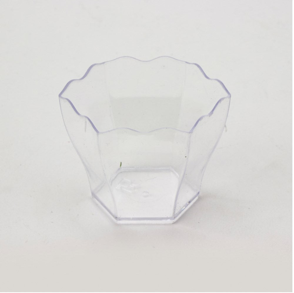 Clear plastic cup with a scalloped rim, hexagonal base, and 3oz capacity.