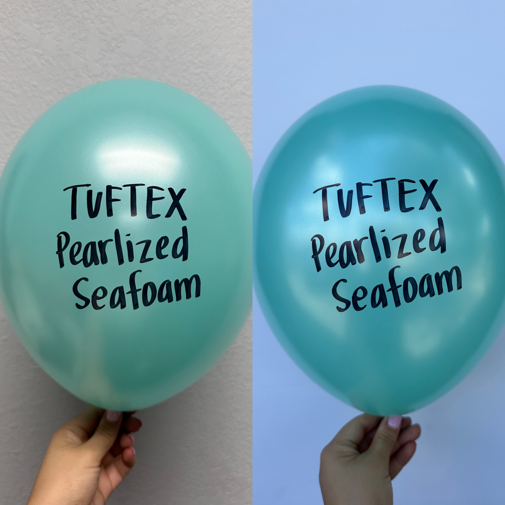 Two 5-inch pearlized latex balloons in seafoam green, held against a neutral background, showing light reflection on smooth.