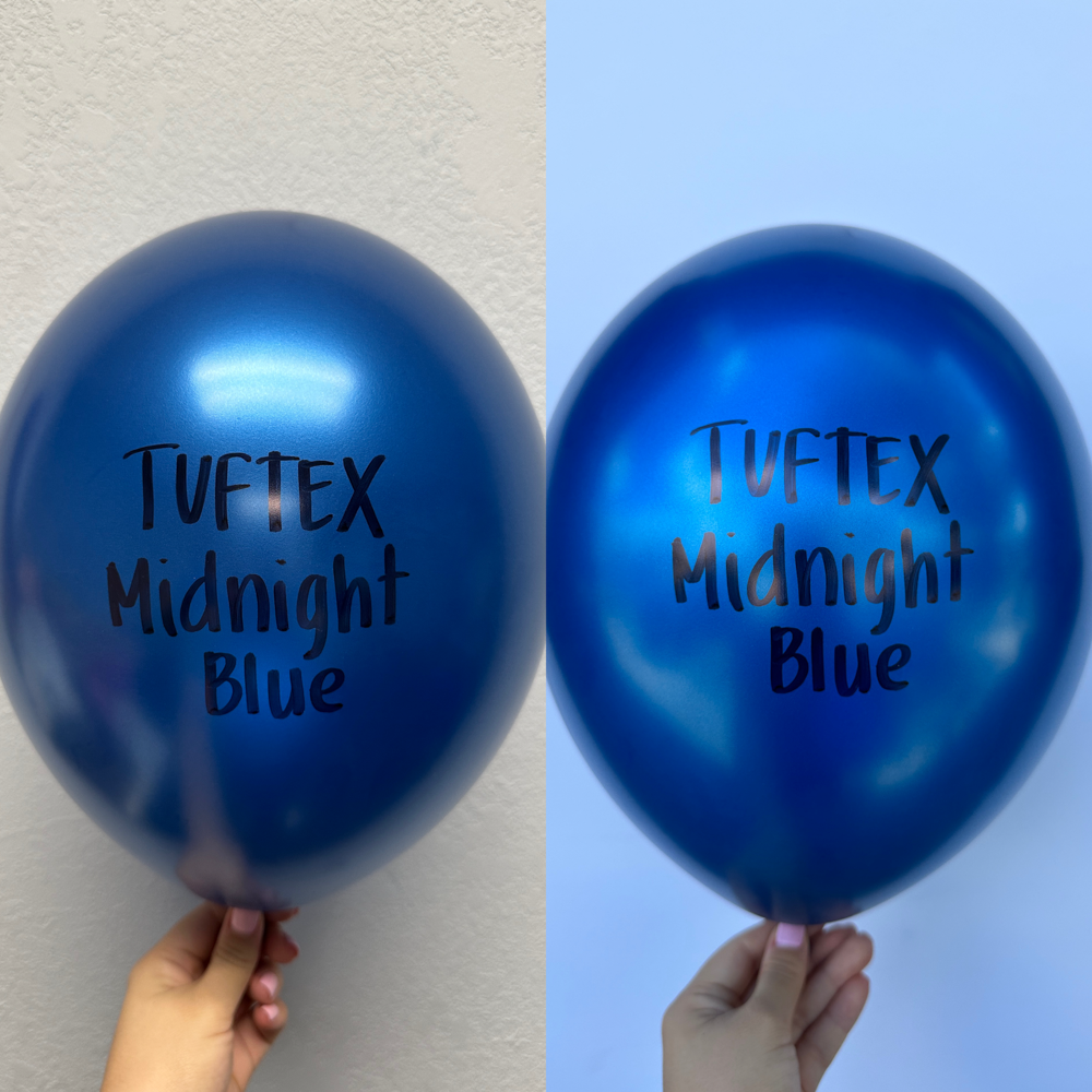 Shiny pearlized midnight blue 5-inch latex balloons held against a white background, with black "Tuftex Midnight Blue" text.