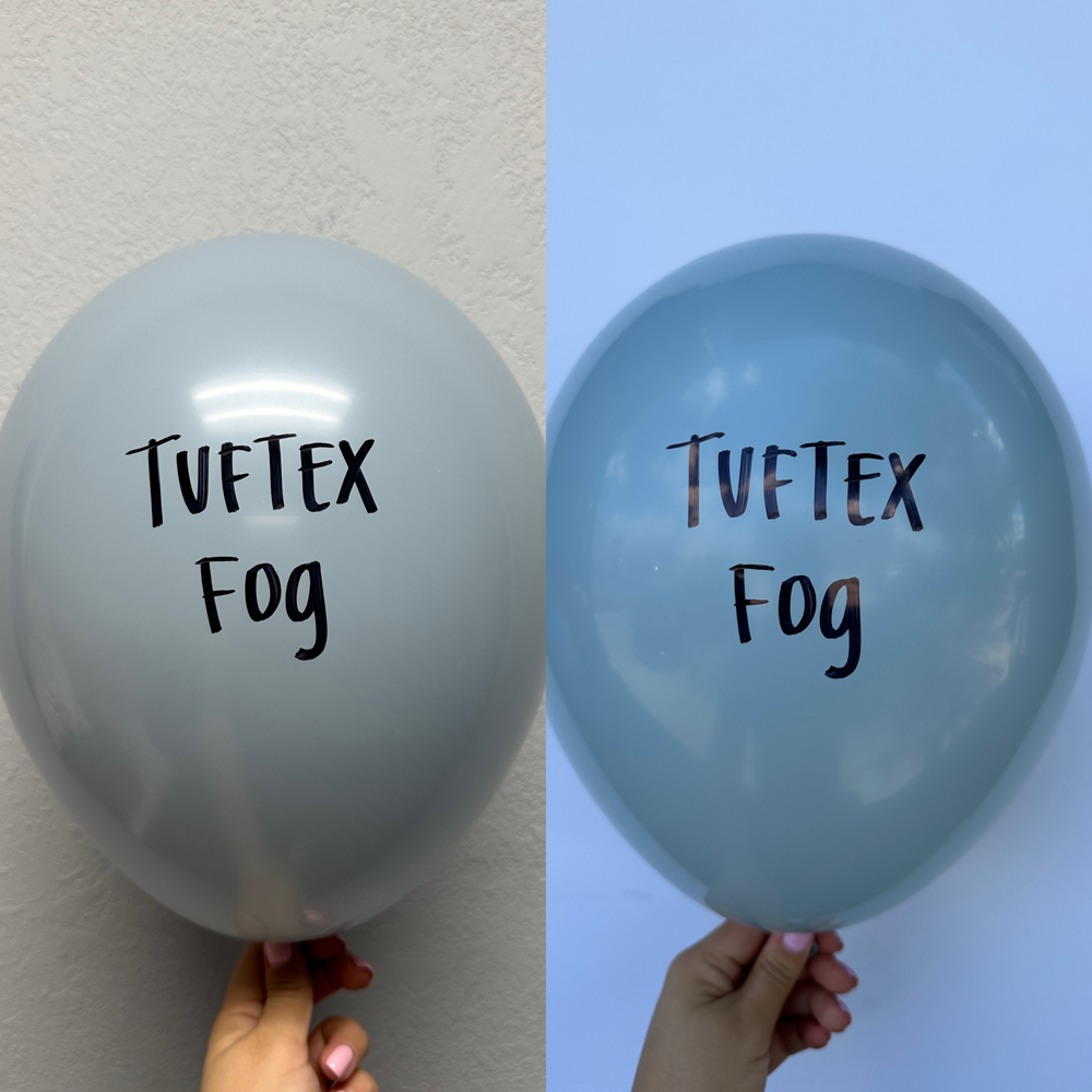 Set of two 5-inch latex balloons in fog blue, each printed with "Tuftex Fog" in black text.