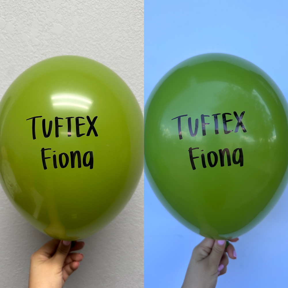 Green 5-inch latex balloon with Tuftex Fiona black logo, glossy finish, inflated, held by hand.