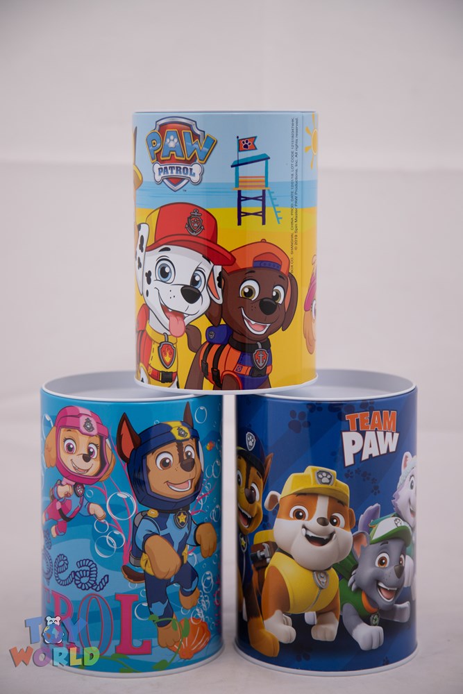 Two cylindrical Paw Patrol-themed saving banks featuring colorful cartoon dog characters on blue and yellow backgrounds.