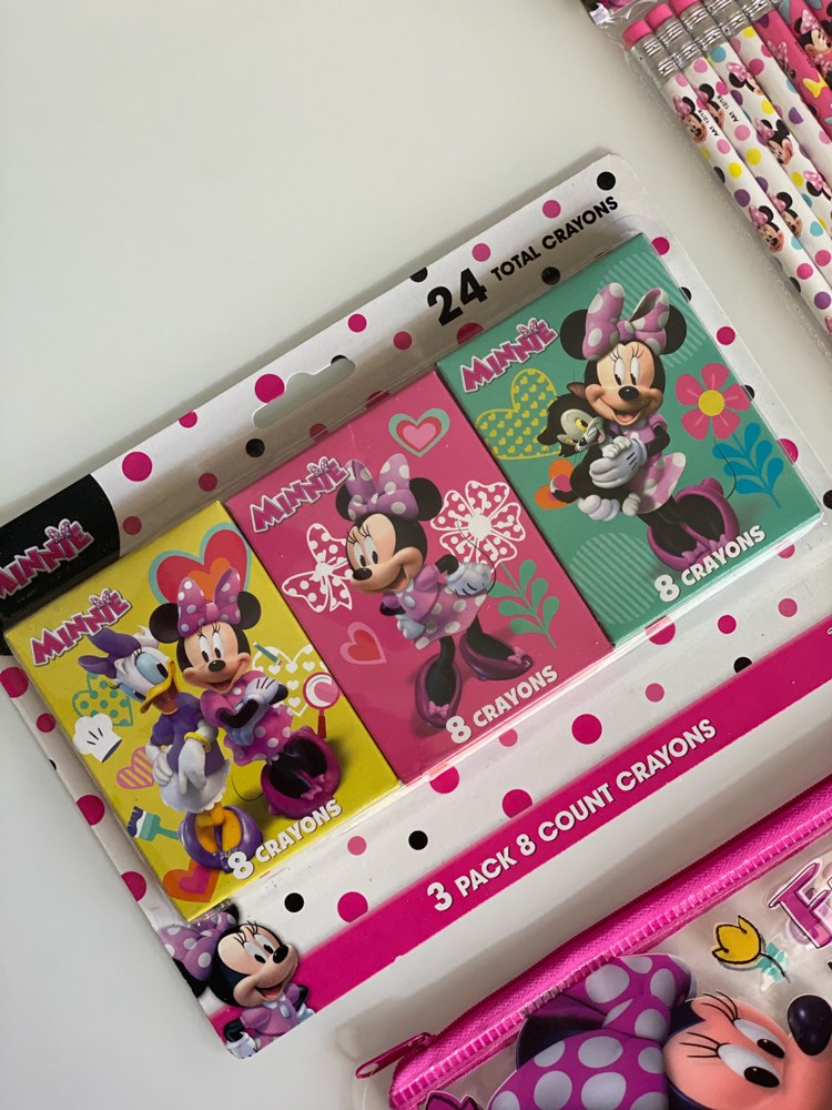 Three-pack of Minnie Mouse crayons in colorful cardboard boxes featuring Minnie in various poses, packaged in a clear.