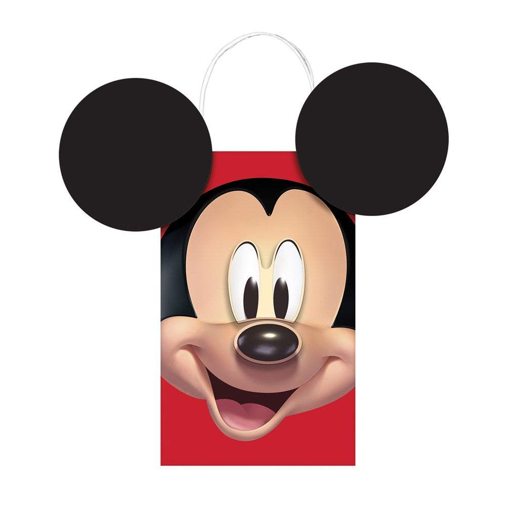Red gift bag with large printed Mickey Mouse face and attached black Mickey ears handles.