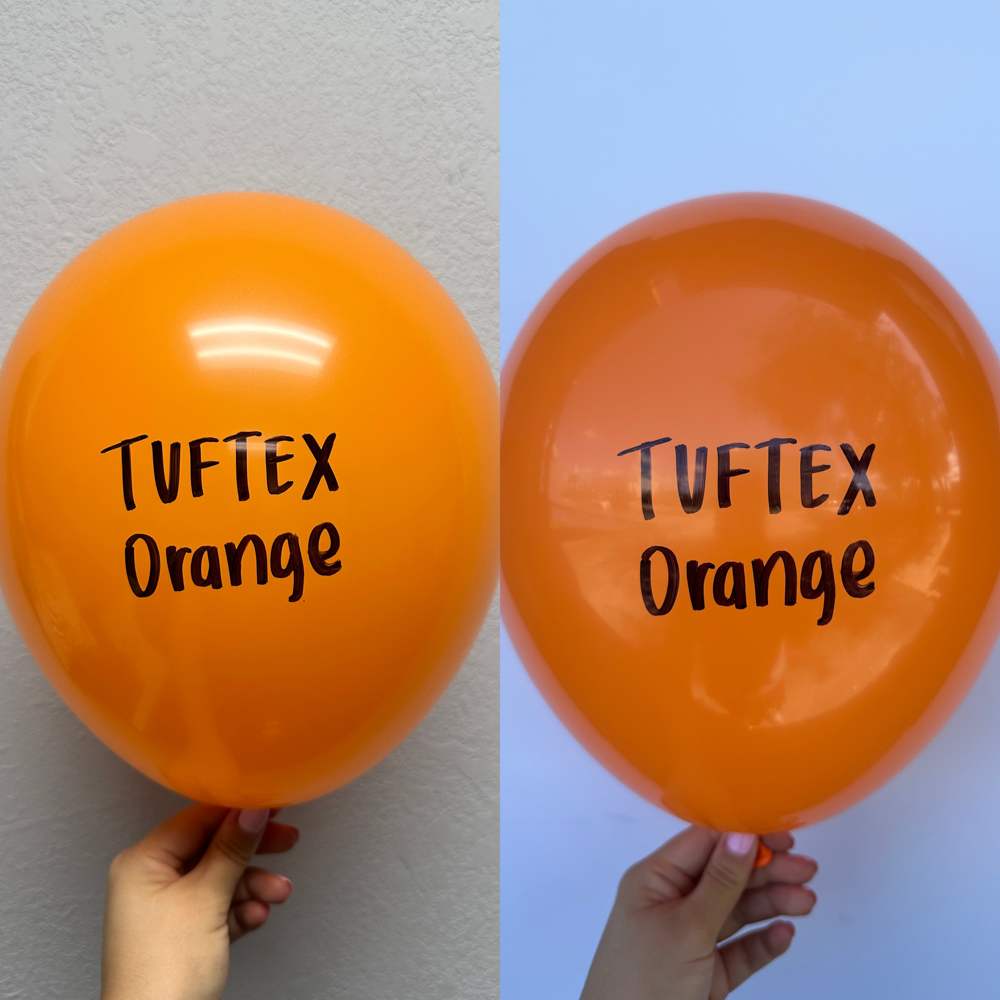 Bright orange 17-inch latex balloon with black "Tuftex Orange" text held against white and blue backgrounds.