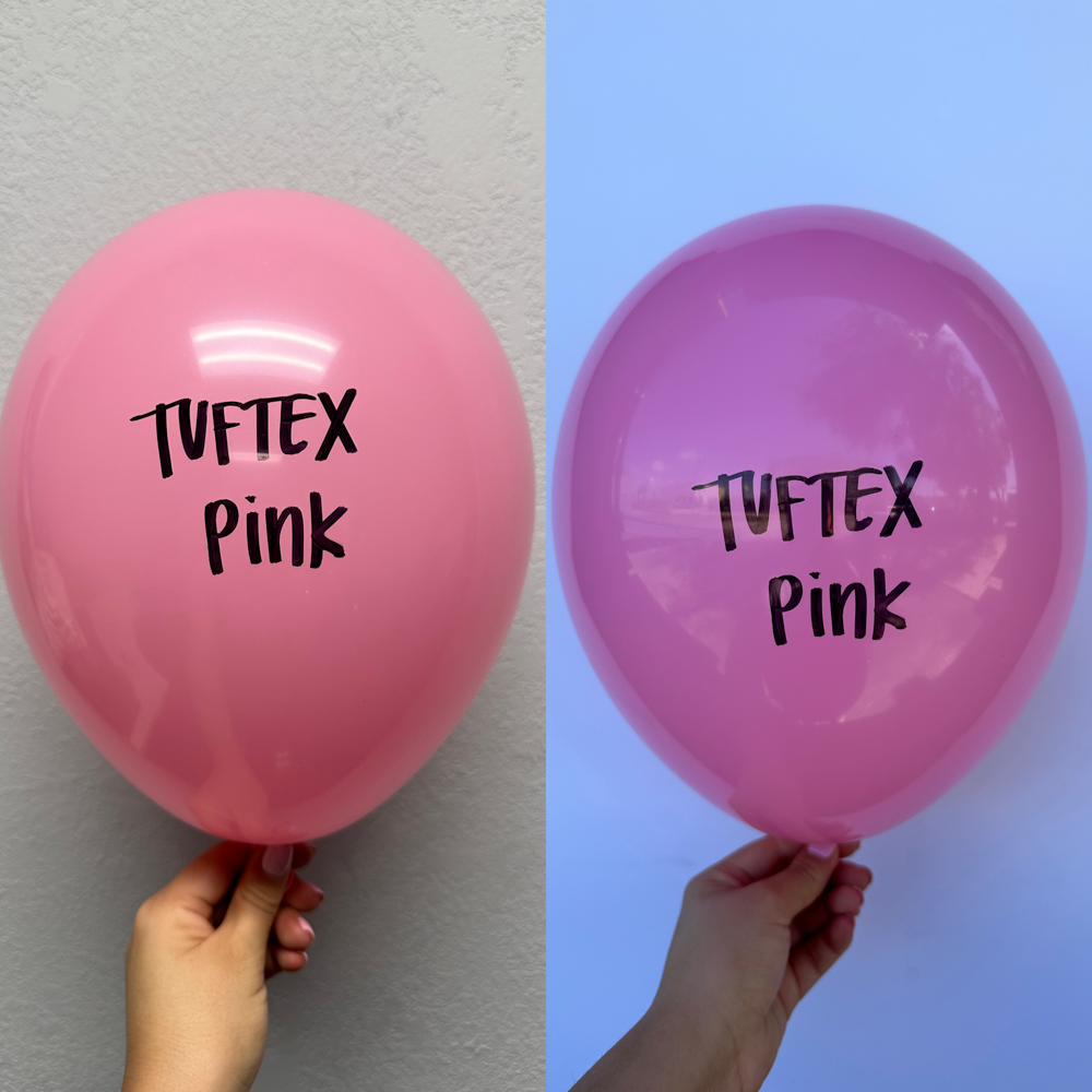 Two 17-inch pink latex balloons, one inflated and held against a light gray wall, the other inflated and held against a blue