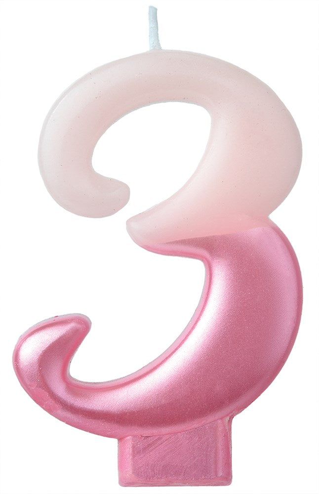 Pink numeral 3 birthday candle with a curled design and a wick on top.