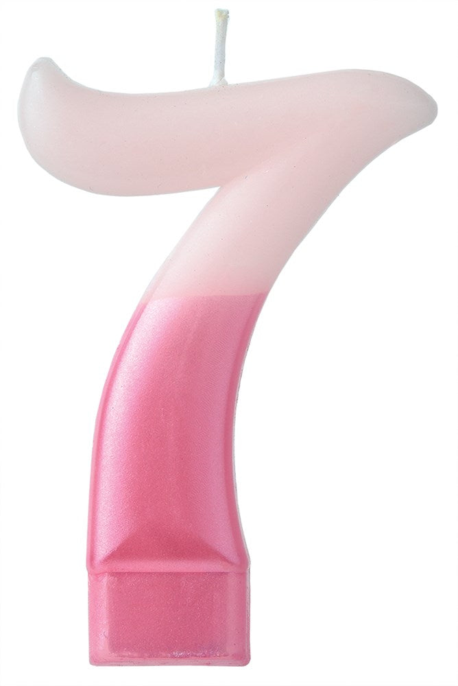 Pink gradient numeral 7 birthday candle with white wick and rectangular base.