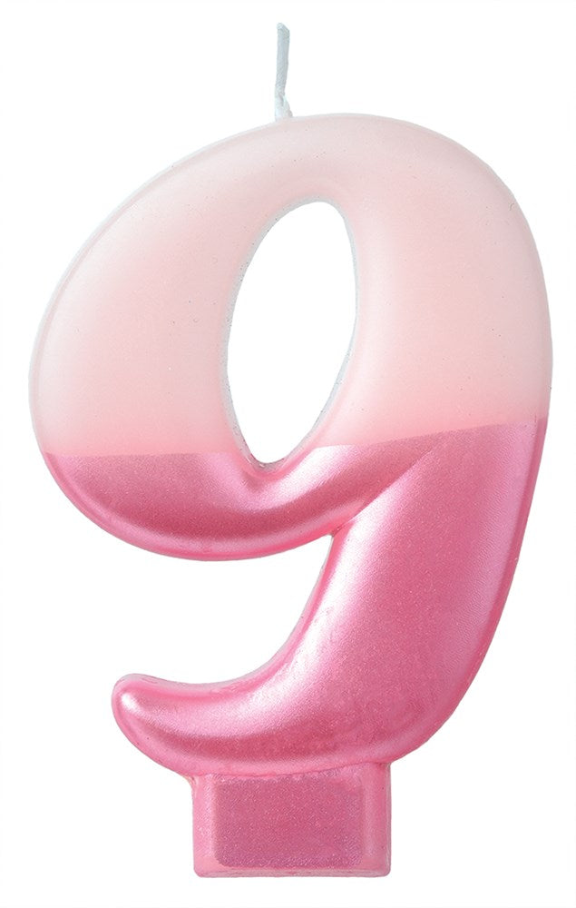 Pink gradient numeral 9 birthday candle with smooth glossy finish and wick on top.