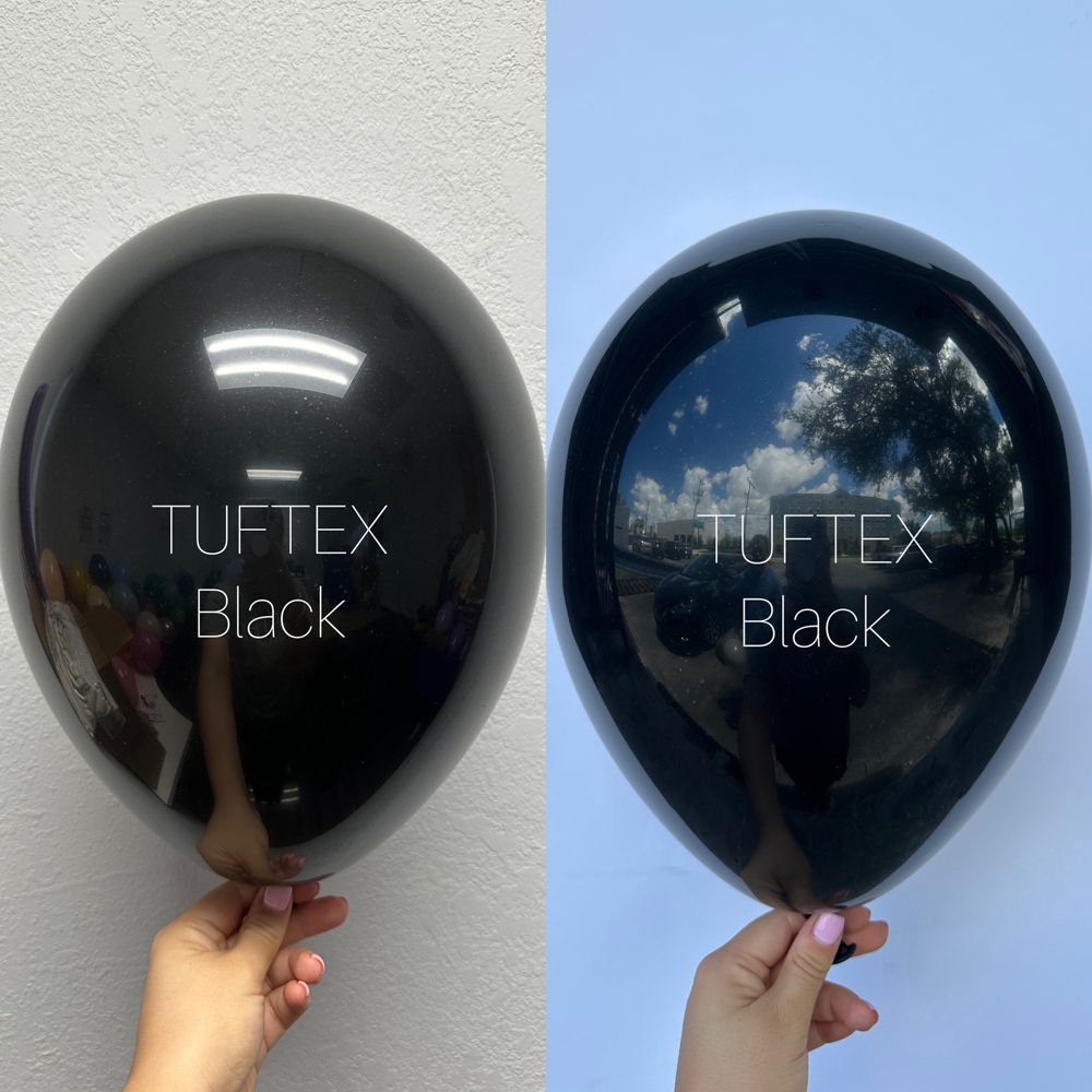 Glossy black latex balloon, 17 inches, reflecting indoor and outdoor light, round shape, inflated.