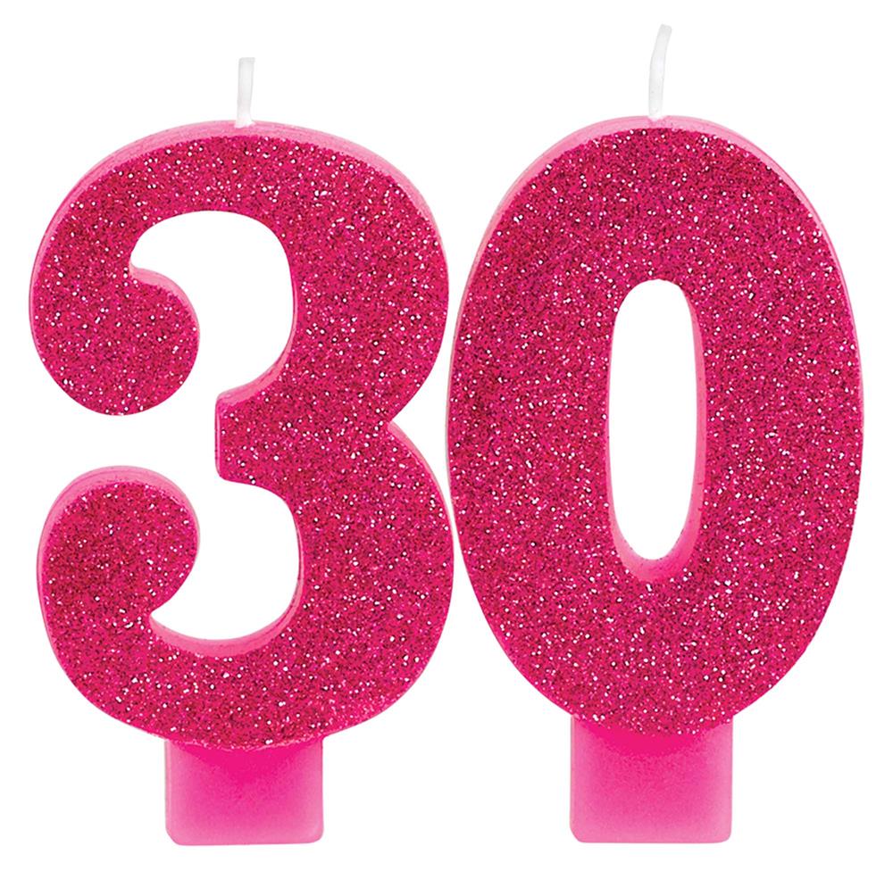 Pink-gold glitter numeral candles shaped as number 3 and 0 with white wicks and pink bases.