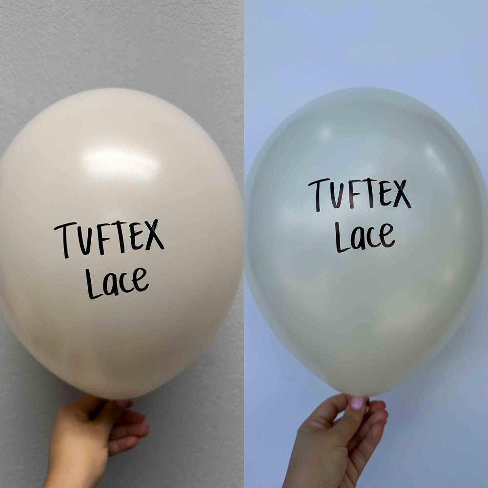 Two 17-inch latex balloons, one white and one pale blue, each printed with "Tuftex Lace" in black text.