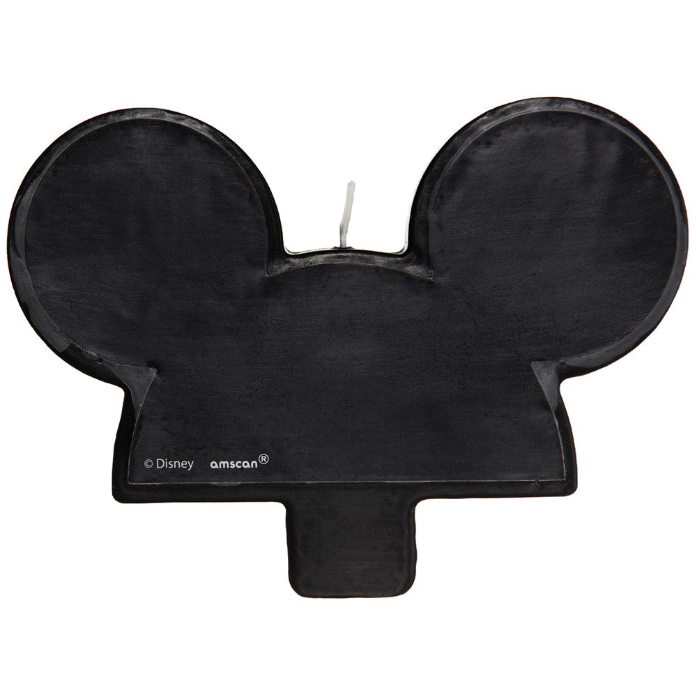 Black wax birthday candle shaped like Mickey Mouse's head with two round ears and a short rectangular base.