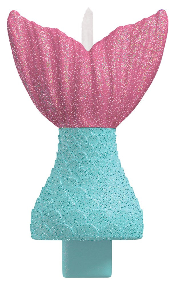 Pink glittery mermaid tail candle with textured teal base for birthday cakes.