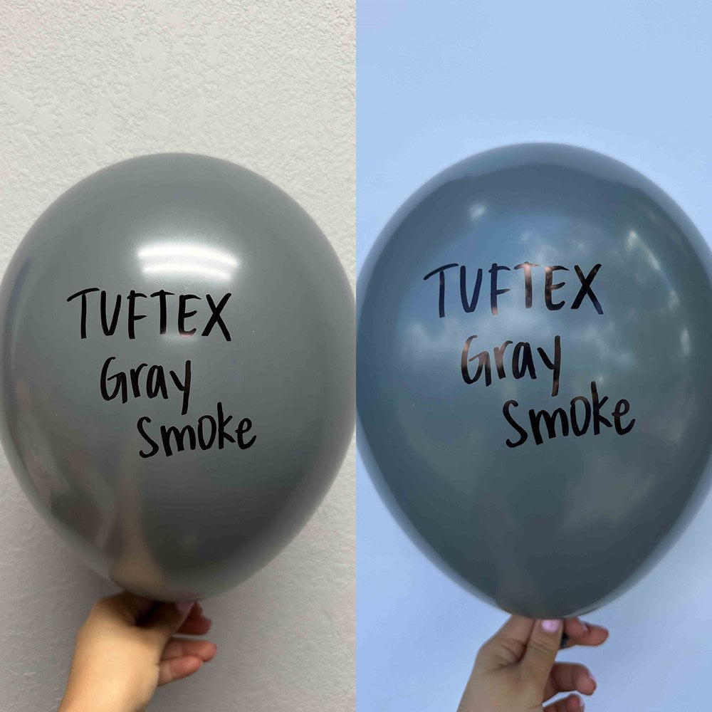 Two 17-inch gray latex balloons with "Tuftex Gray Smoke" printed in black text, held against a neutral background.