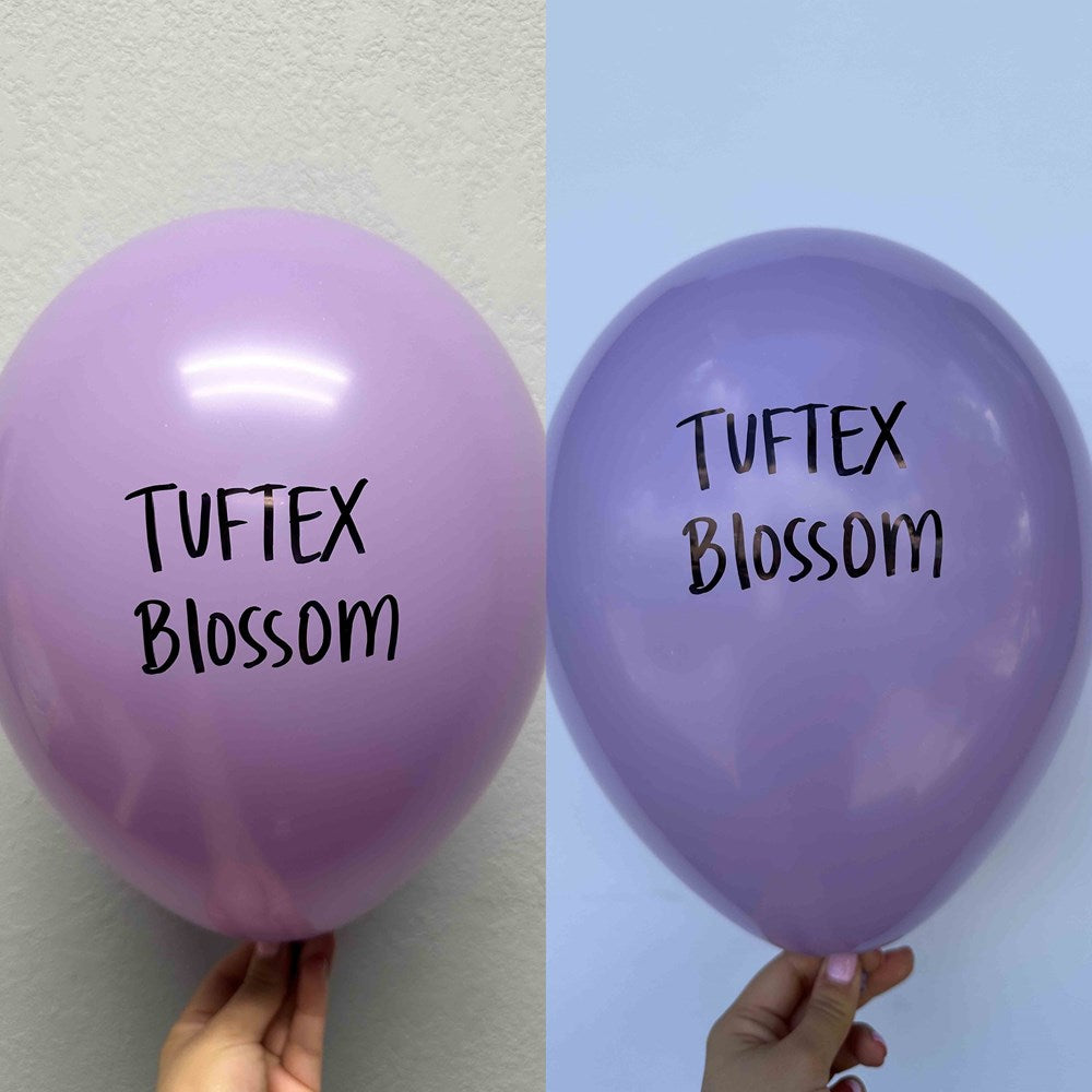 Two 17-inch latex balloons in light and medium purple shades, each printed with "Tuftex Blossom" in black text.