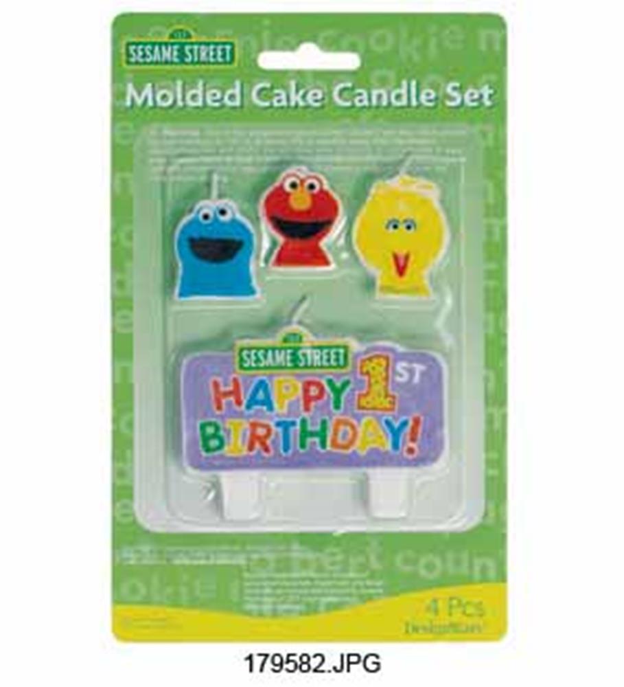 Sesame Street cookie monster, elmo, big bird character candles and colorful "Happy 1st Birthday" candle set in plastic.