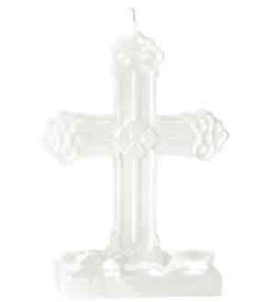 White decorative cross-shaped candle with floral accents and a wick at the top.
