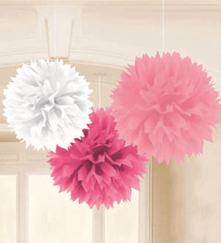 Three hanging fluffy tissue paper pom-poms in white, dark pink, and light pink.