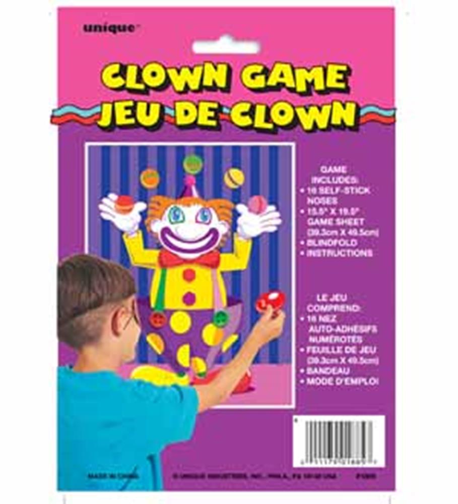 Clown face game board with red noses and a boy placing red nose pieces on it, bright pink packaging.