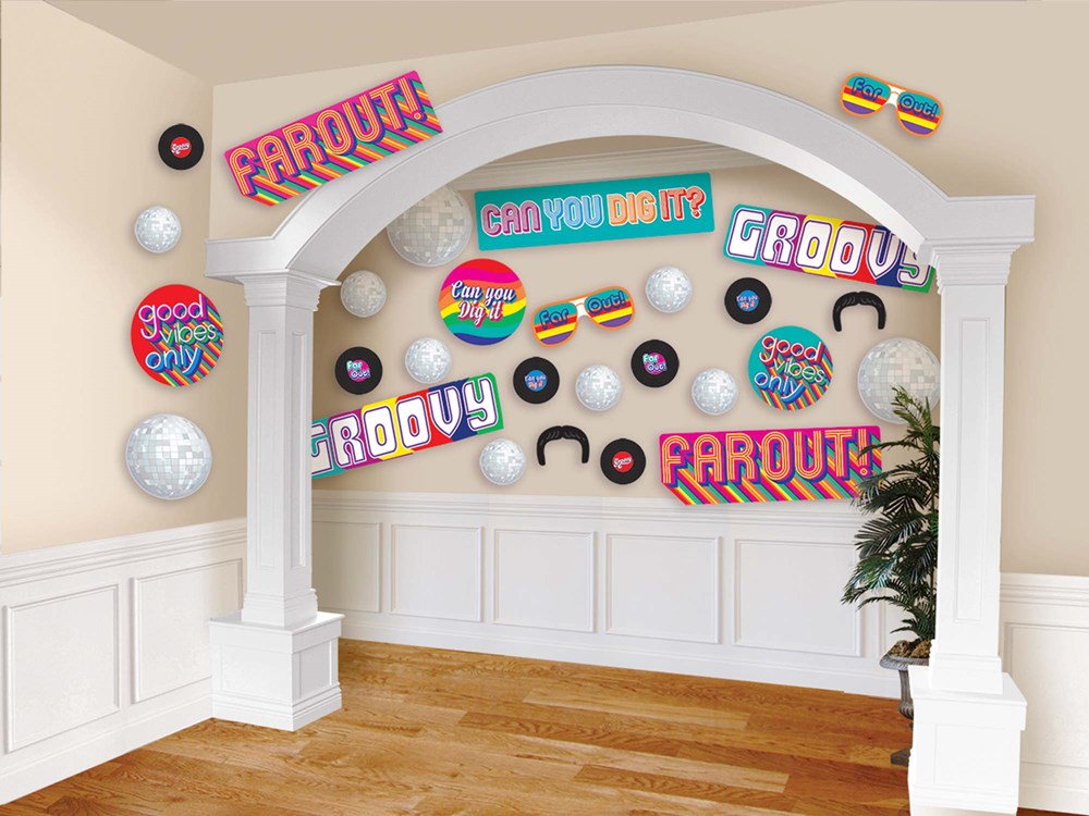 Colorful retro-themed birthday cutouts with phrases like "Farout!", "Groovy", and "Can you dig it?" displayed on a wall arch.