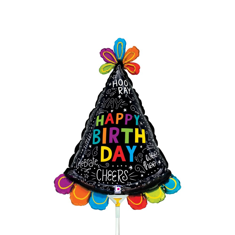 Black cone-shaped birthday hat balloon with colorful "Happy Birthday" text, doodles, and multicolor fringe at the base.