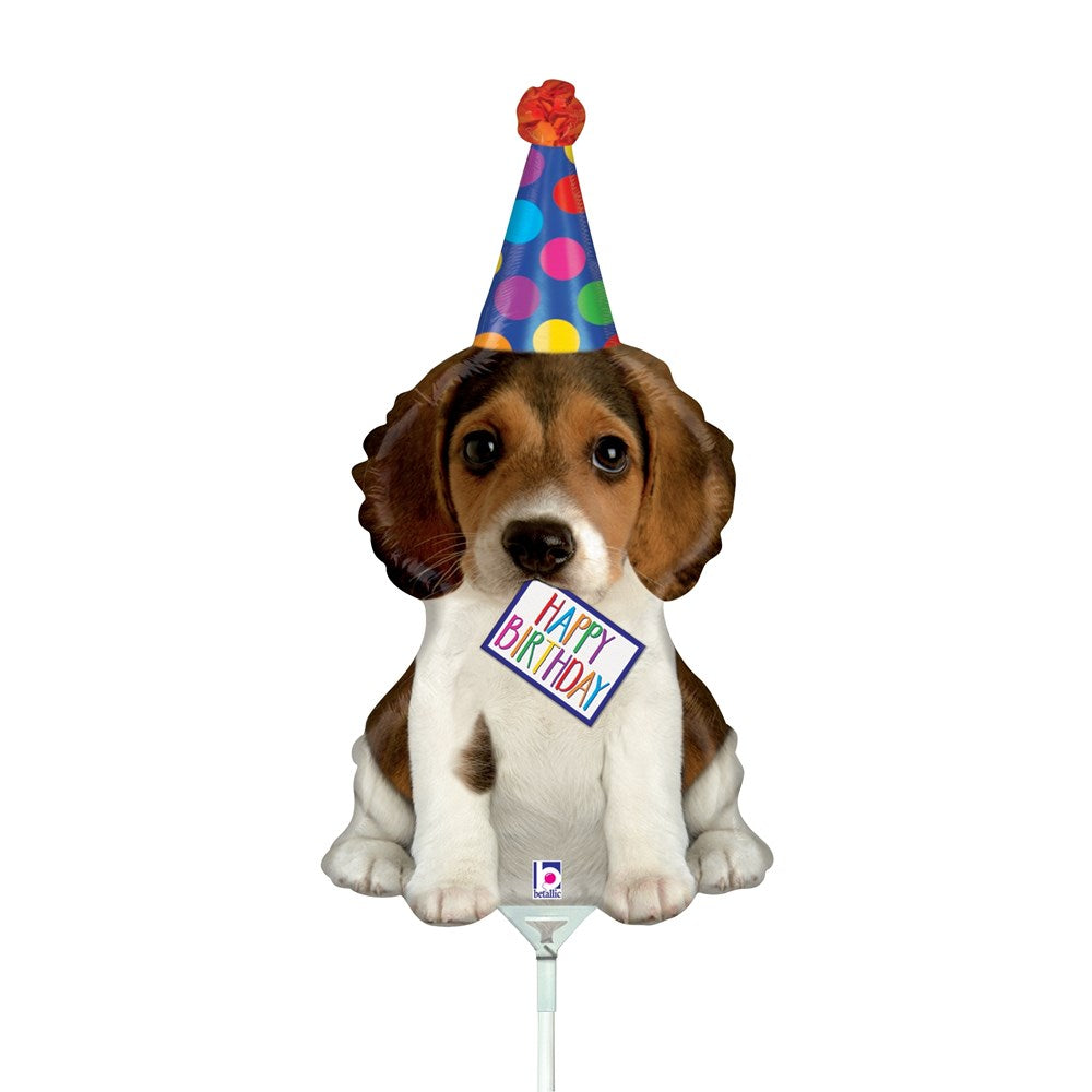 14-inch foil balloon shaped like a brown and white puppy wearing a colorful polka-dot birthday hat and holding a "Happy.