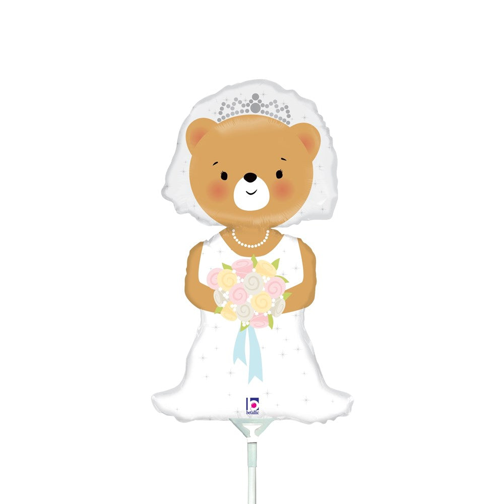14-inch foil balloon shaped like a bride bear wearing a white wedding dress and veil, holding a bouquet of pink and yellow.
