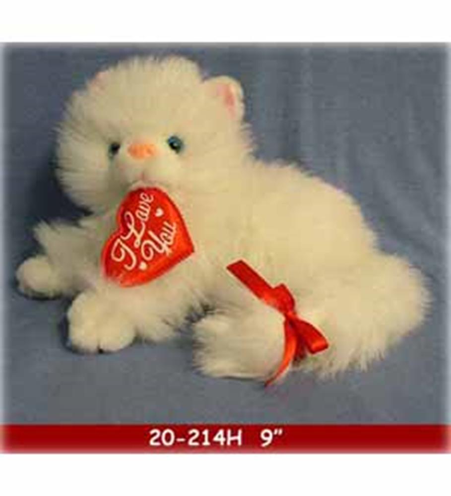 White fluffy plush cat holding a red heart with "Love You" text and red ribbon on tail.