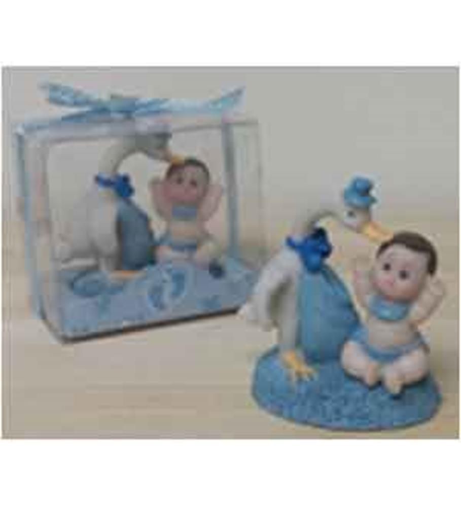 Blue stork figurine carrying a white bundle next to a baby in blue outfit on textured blue base with matching gift box.